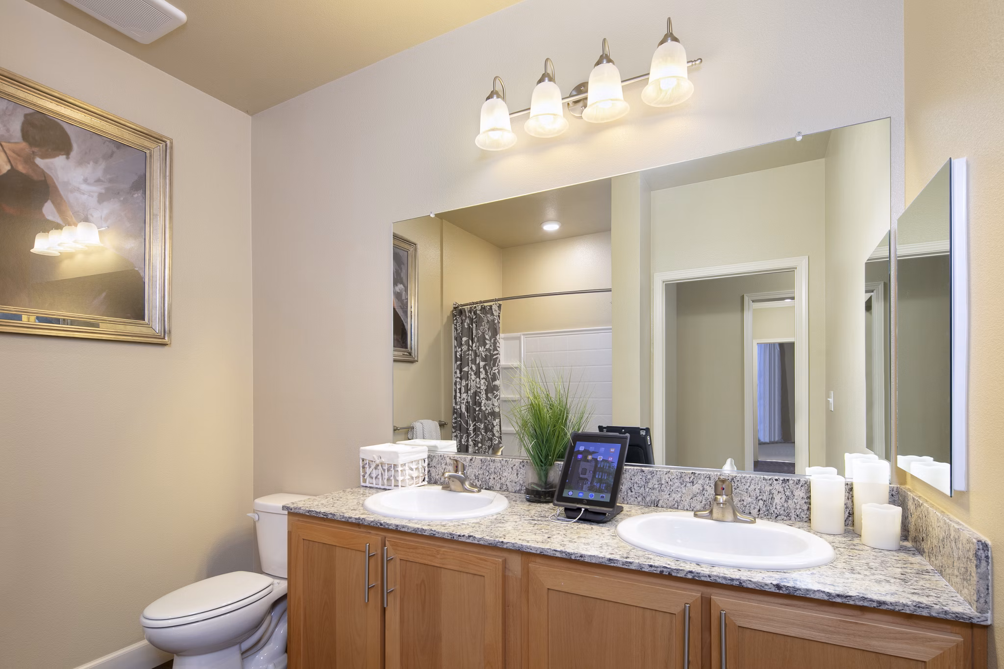 Modern bathroom featuring marble counters and sleek fixtures in Fiori Estates Apartments luxury community
