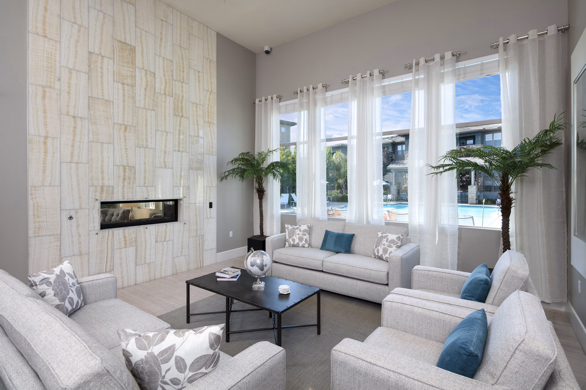 Clubhouse with modern design and cozy seating areas at Fiori Estates Apartments