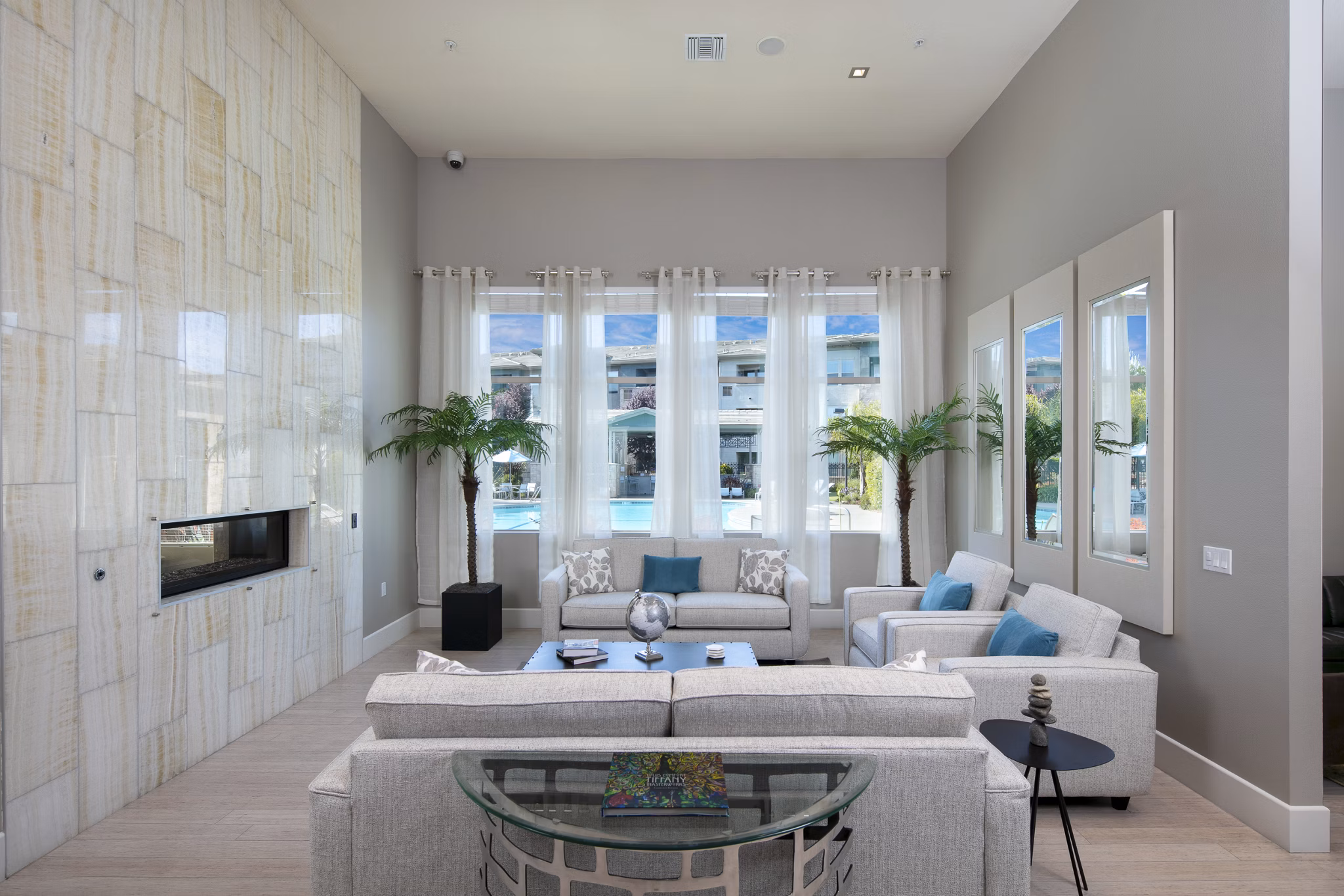 Clubhouse with modern design and comfortable seating at Fiori Estates Apartments