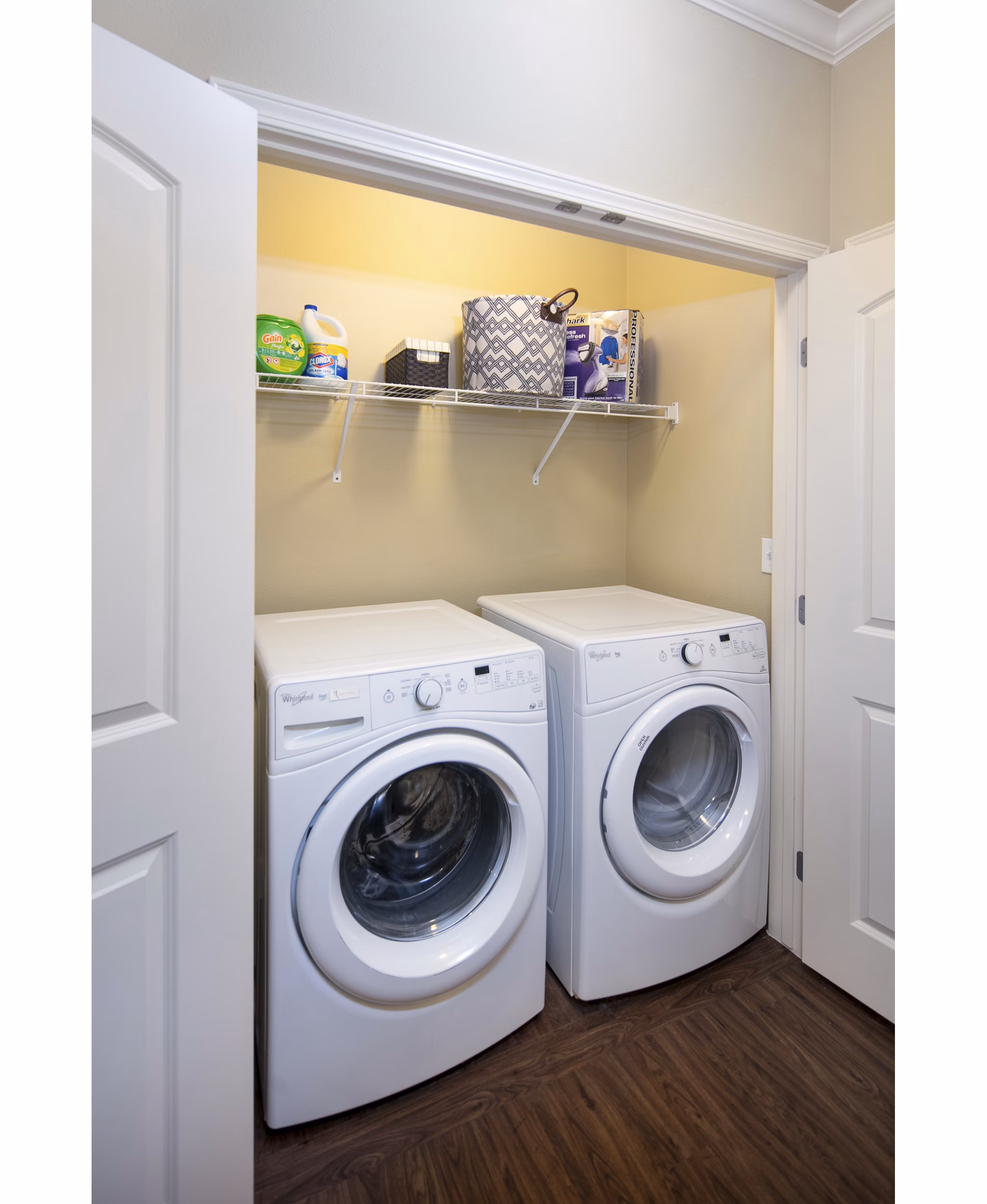 Laundry room with modern appliances at Fiori Estates Apartments