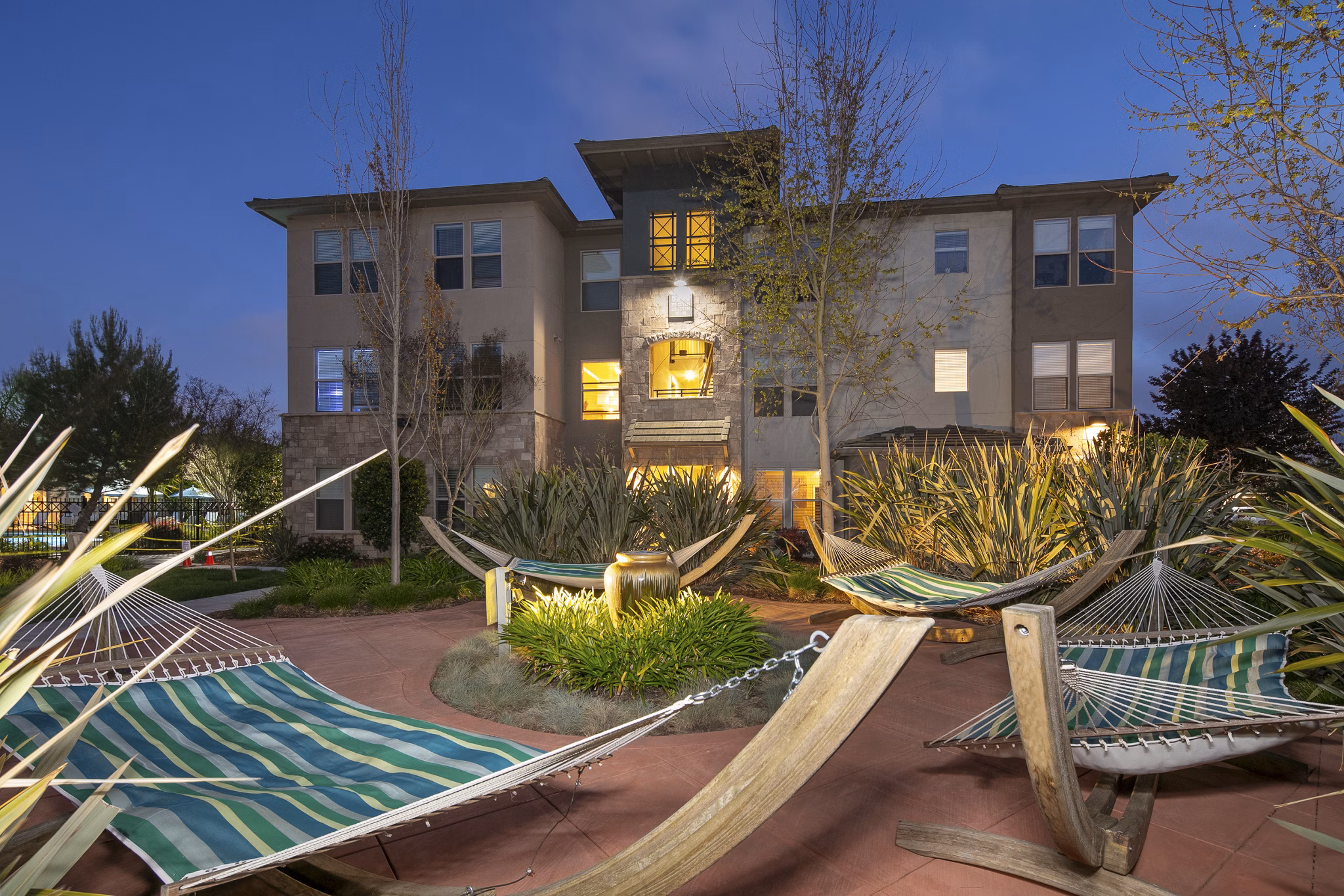 Tranquil courtyard with lush landscaping at Fiori Estates Apartments, creating a serene outdoor retreat