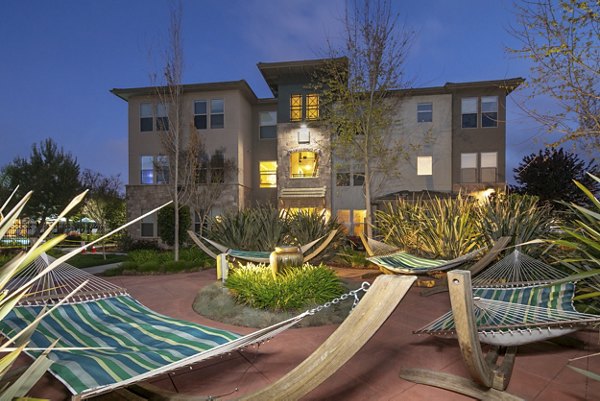 Tranquil courtyard with lush landscaping at Fiori Estates Apartments, creating a serene outdoor retreat
