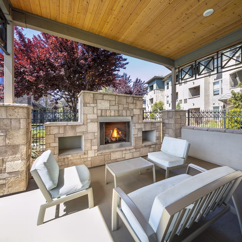 Fire pit seating area at Fiori Estates Apartments, offering a cozy outdoor amenity for residents