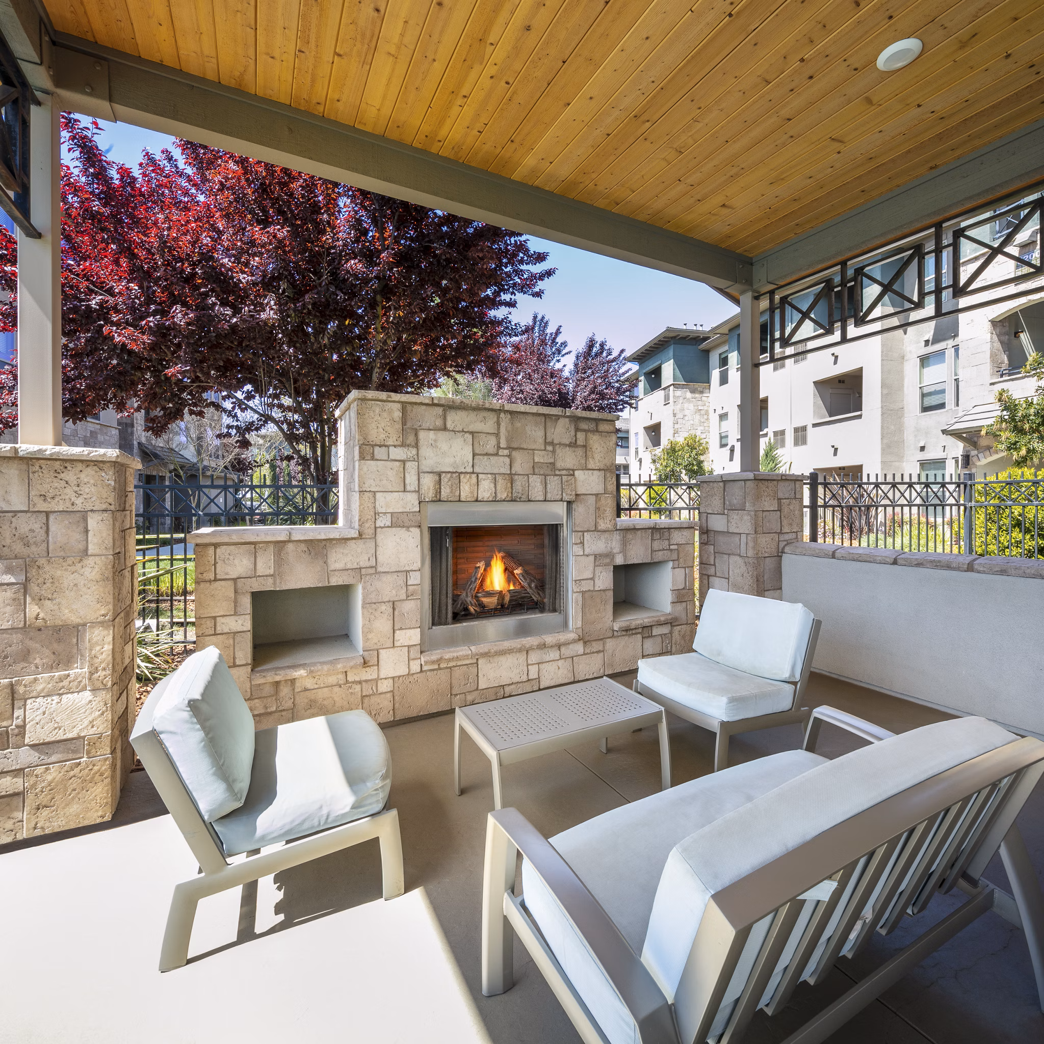 Fire pit seating area at Fiori Estates Apartments, offering a cozy outdoor amenity for residents
