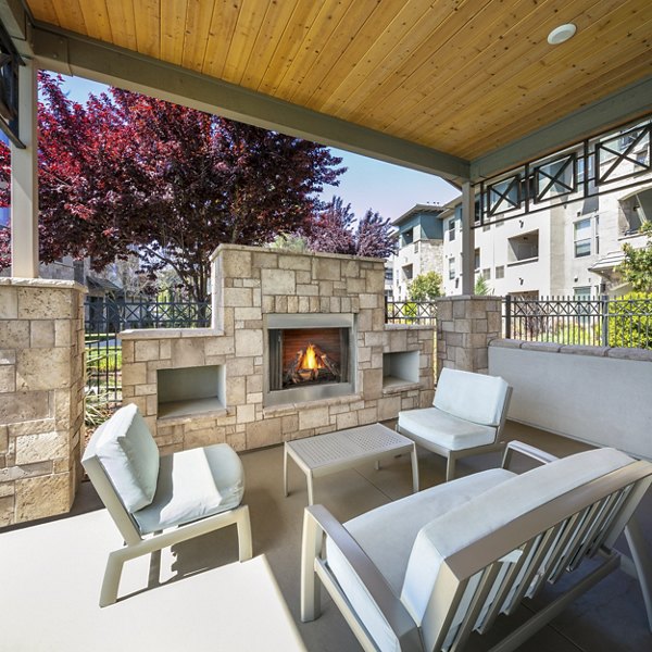 Fire pit seating area at Fiori Estates Apartments, offering a cozy outdoor amenity for residents