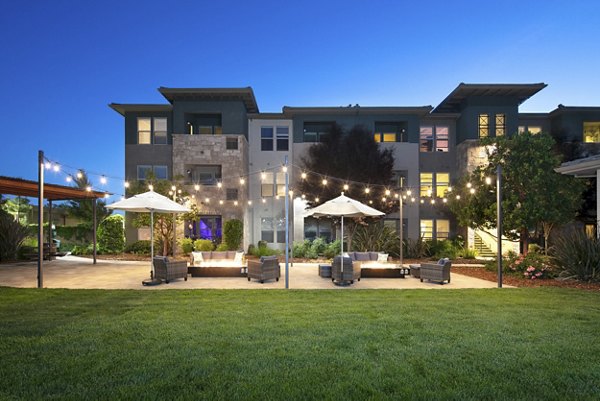 Courtyard with lush garden seating area at Fiori Estates Apartments