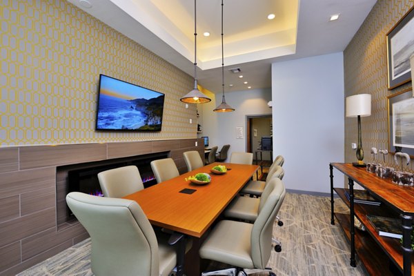 Business center featuring modern workstations at The Townhomes at Woodmill Creek luxury apartments