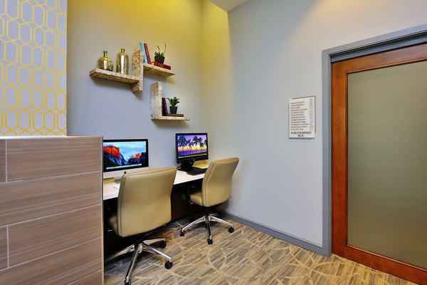 Business center with modern decor at The Townhomes at Woodmill Creek luxury apartments