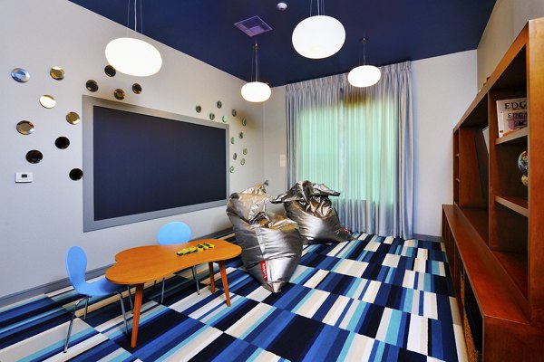 Clubhouse featuring modern design and cozy seating at The Townhomes at Woodmill Creek