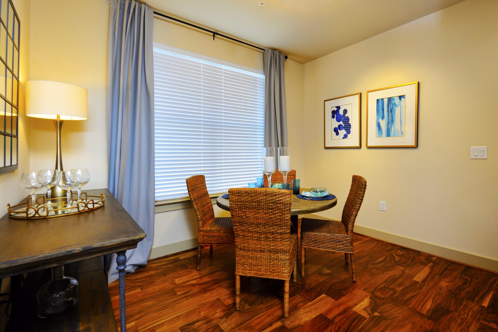 Dining area featuring modern furniture and elegant lighting at The Townhomes at Woodmill Creek apartments