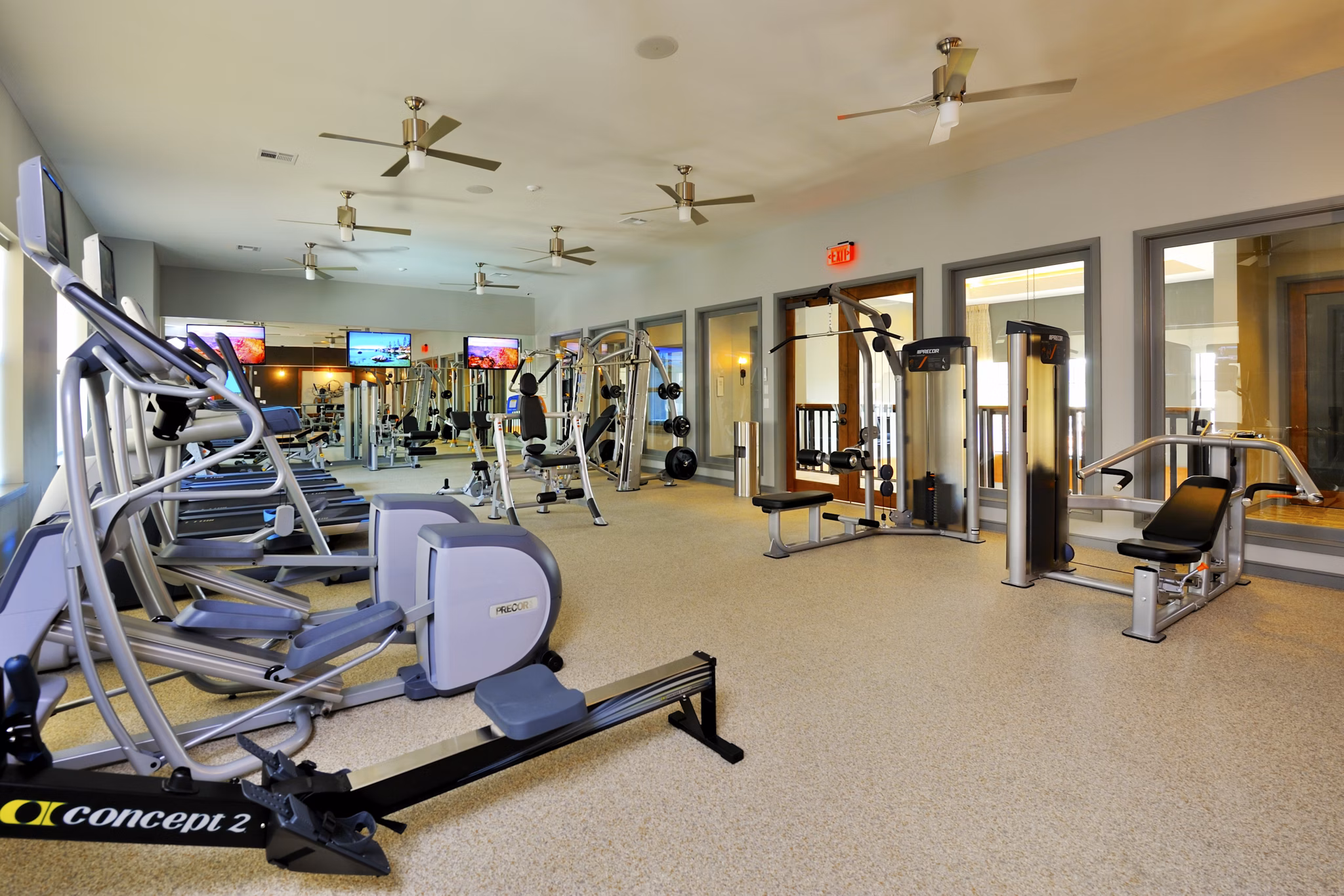 Modern fitness room with state-of-the-art equipment at The Townhomes at Woodmill Creek