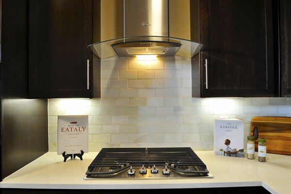 Modern kitchen detail featuring stainless steel appliances at The Townhomes at Woodmill Creek