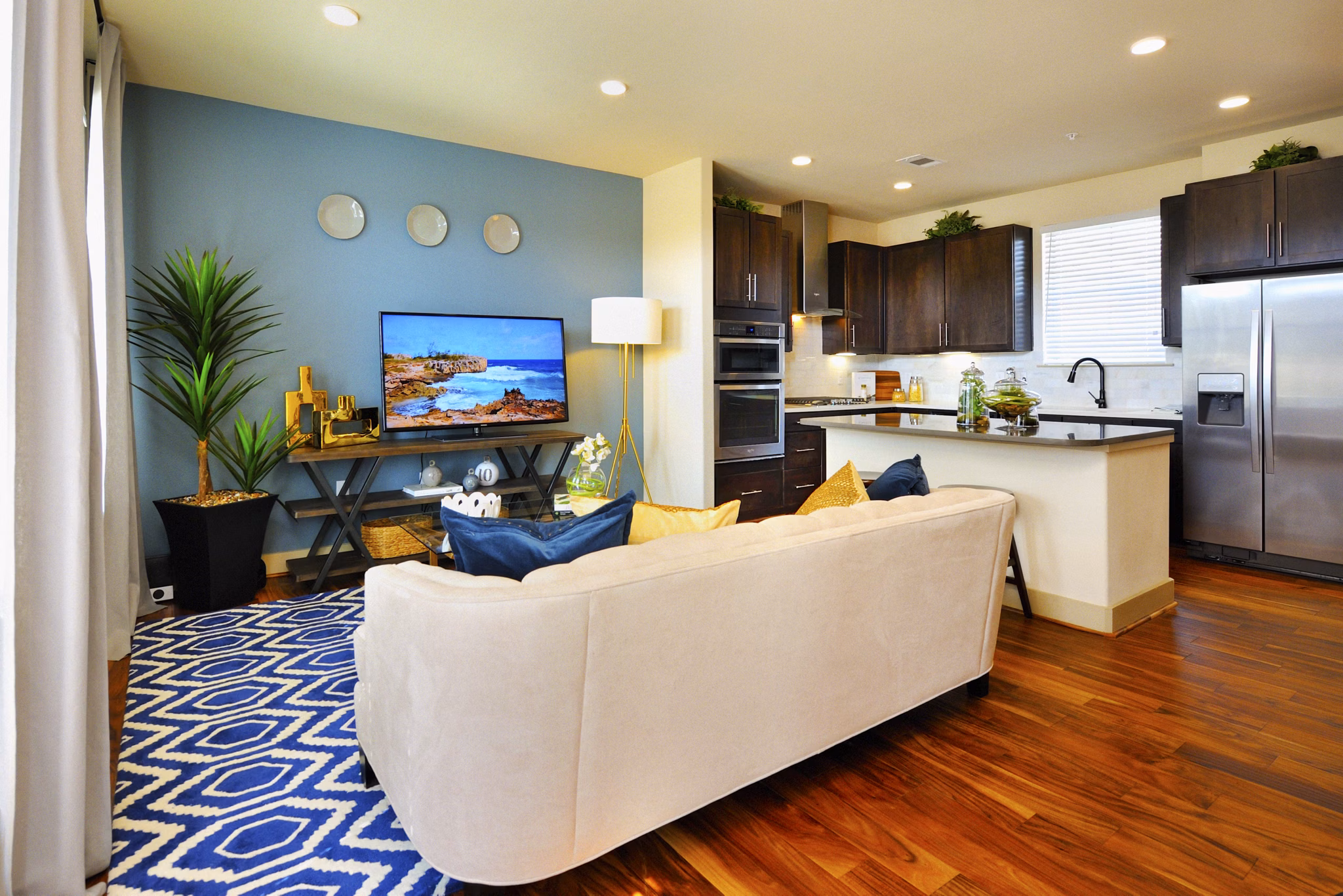 Spacious living room with elegant decor in The Townhomes at Woodmill Creek, luxury apartments