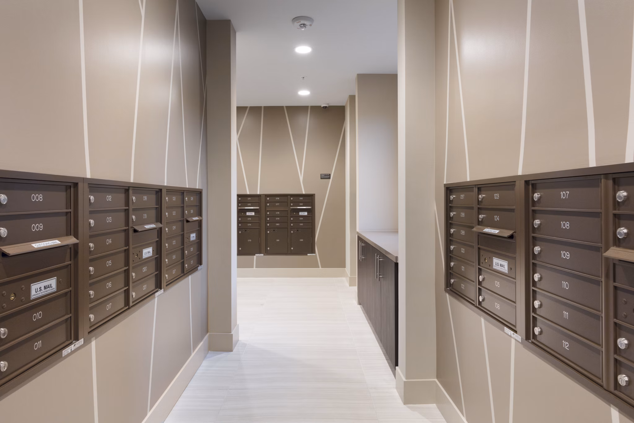 Modern mail room with parcel lockers at 481 on Mathilda Apartments