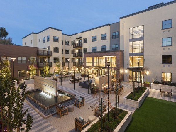 Charming courtyard with lush greenery at 481 on Mathilda Apartments, luxury living by Greystar in sunny Santa Clara
