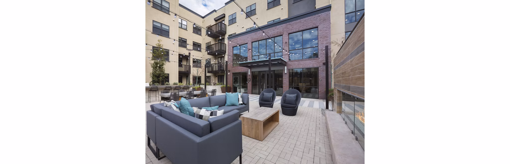 Cozy fire pit area at 481 on Mathilda Apartments offering a perfect outdoor retreat for relaxation and socializing in a modern setting