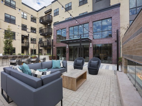 Cozy fire pit area at 481 on Mathilda Apartments offering a perfect outdoor retreat for relaxation and socializing in a modern setting