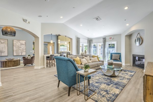 Contemporary clubhouse with modern decor at Stone Canyon Apartments, ideal for social gatherings and events