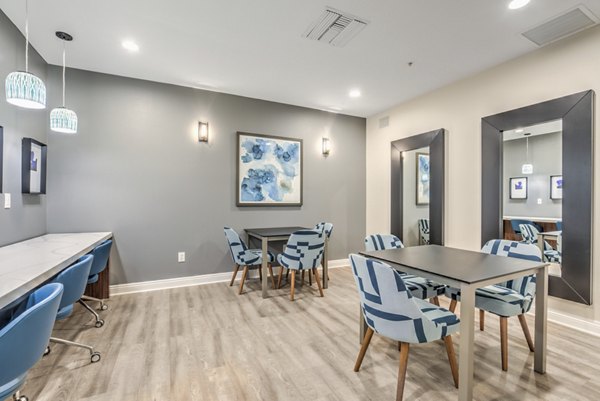 Modern clubhouse featuring sleek furnishings at Stone Canyon Apartments, ideal for social gatherings and leisure activities