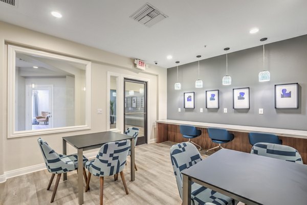 Clubhouse featuring modern furnishings and communal space at Stone Canyon Apartments