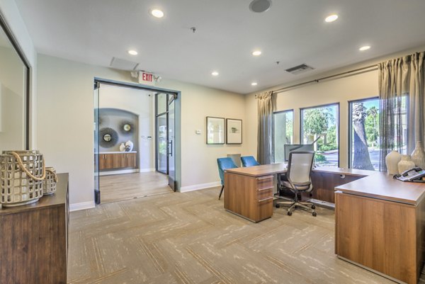 Vibrant game room with pool table and lounge seating at Stone Canyon Apartments