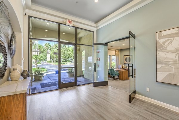 Modern clubhouse with fitness center and lounge area at Stone Canyon Apartments