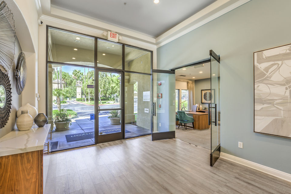 Modern clubhouse with fitness center and lounge area at Stone Canyon Apartments