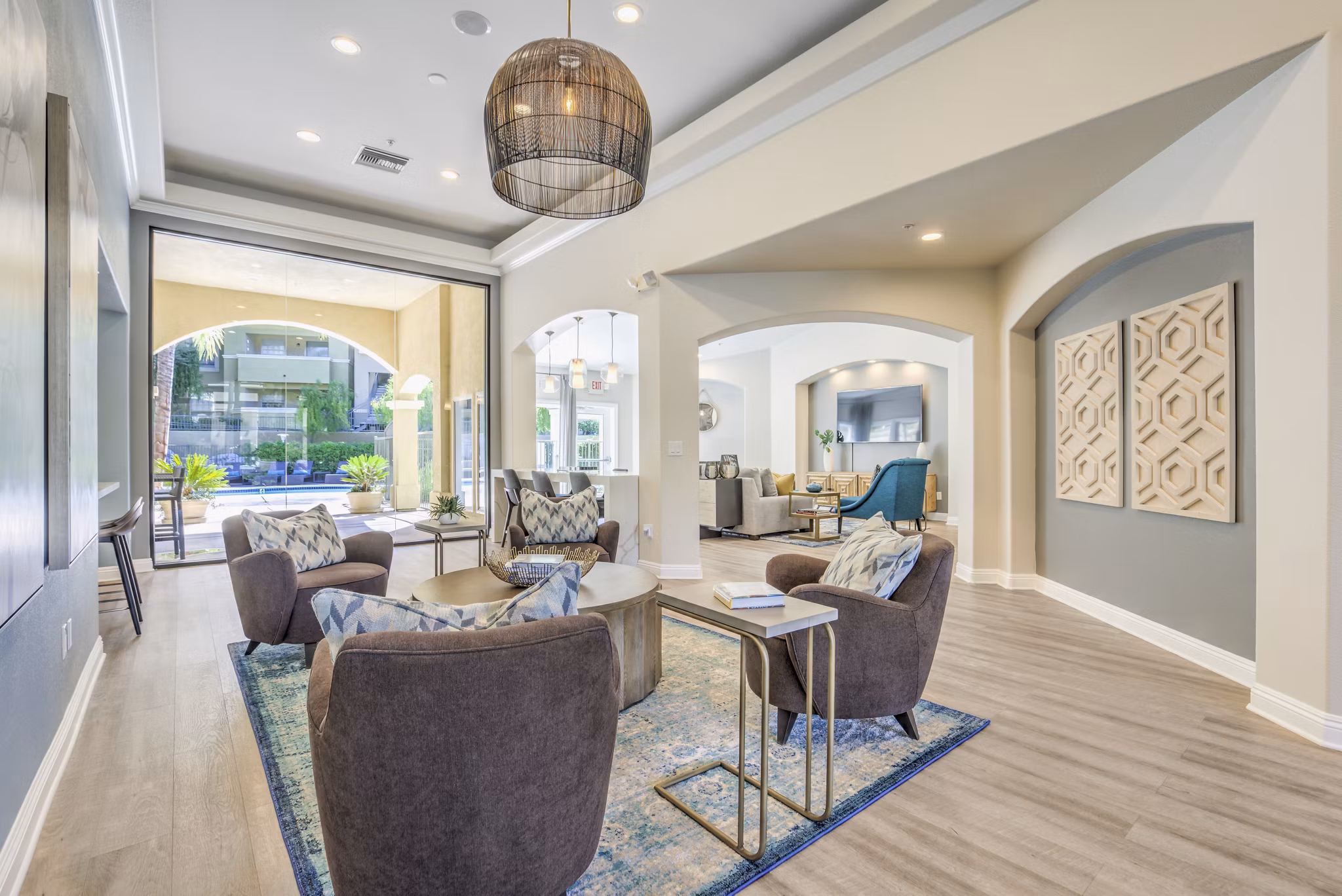 Modern clubhouse featuring elegant seating and large windows at Stone Canyon Apartments