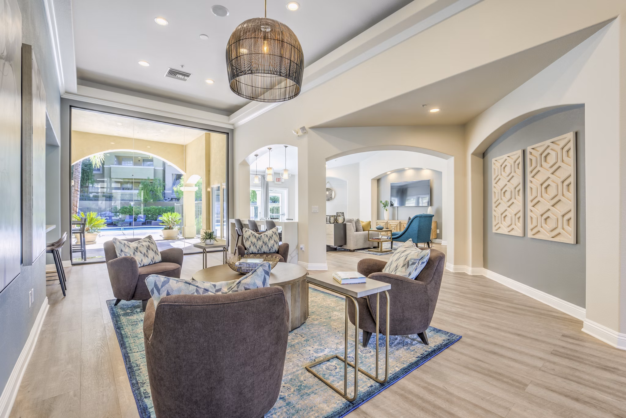 Modern clubhouse featuring elegant seating and large windows at Stone Canyon Apartments