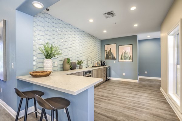 Stylish clubhouse featuring cozy seating and modern decor at Stone Canyon Apartments