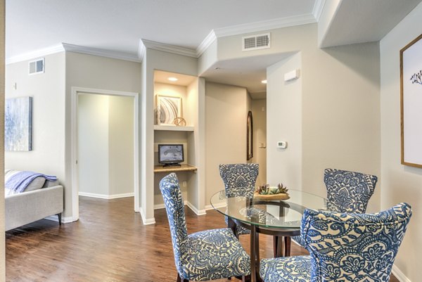 Dining area with modern furnishings and elegant lighting in Stone Canyon Apartments