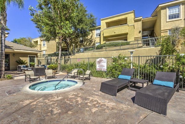 Relaxing hot tub at Stone Canyon Apartments offering luxury amenities for residents, perfect for unwinding after a long day