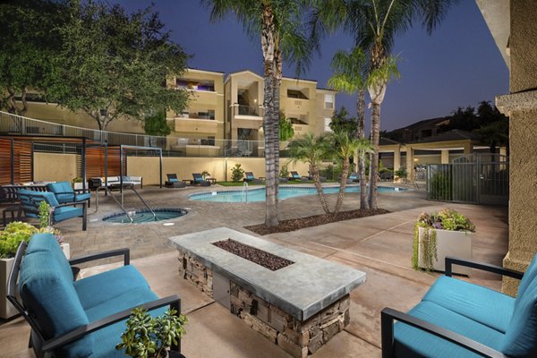 Resort-style swimming pool with cabanas at Stone Canyon Apartments