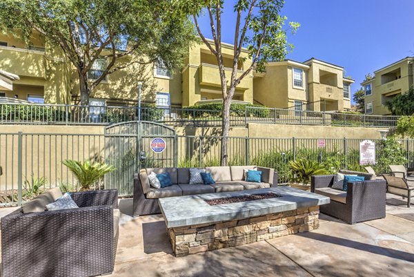 Cozy fire pit area at Stone Canyon Apartments, ideal for evening gatherings and relaxation