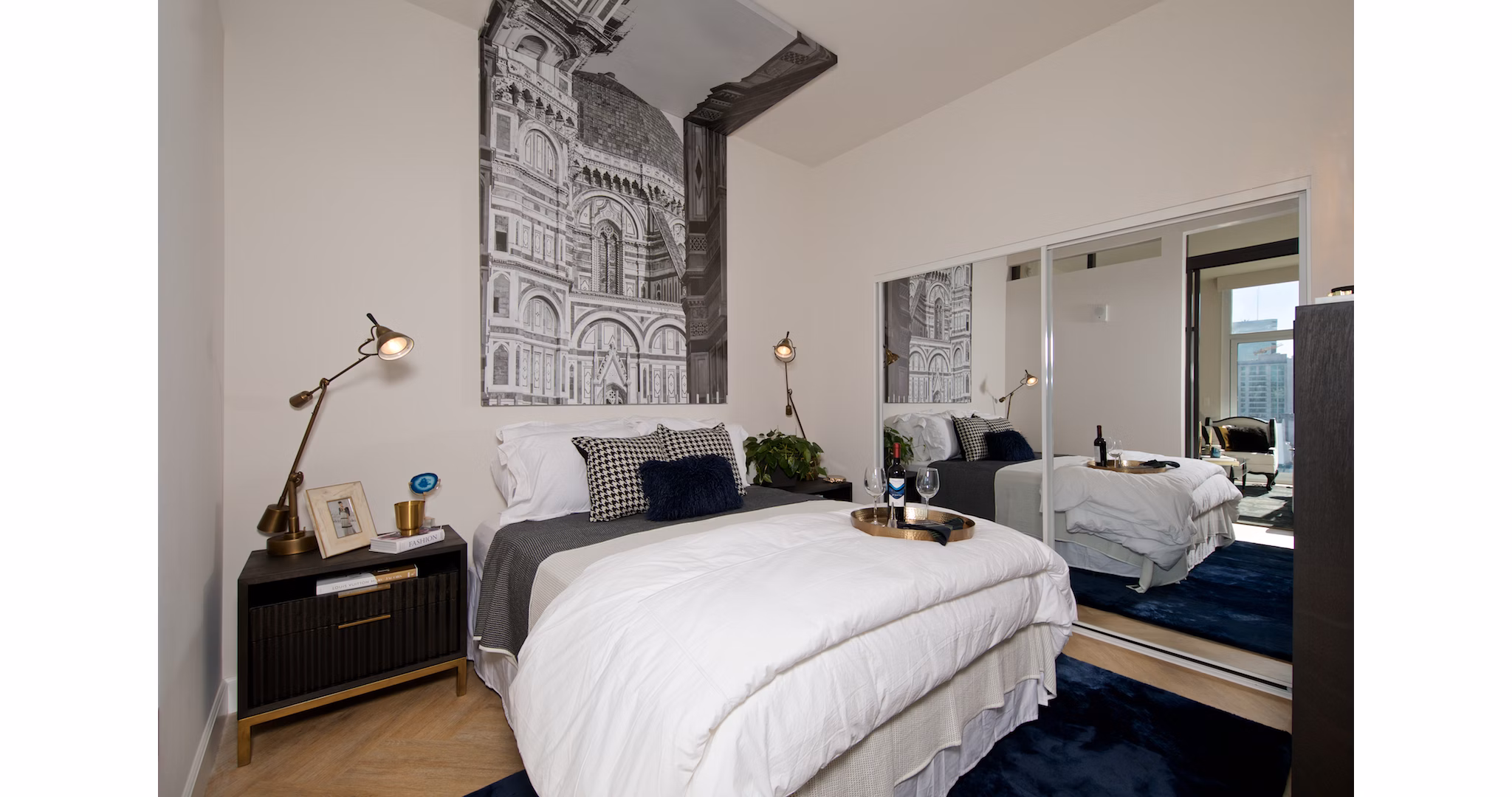 Chic bedroom with modern decor at Eighteen Ten State St Apartments, offering luxury living in a desirable urban location