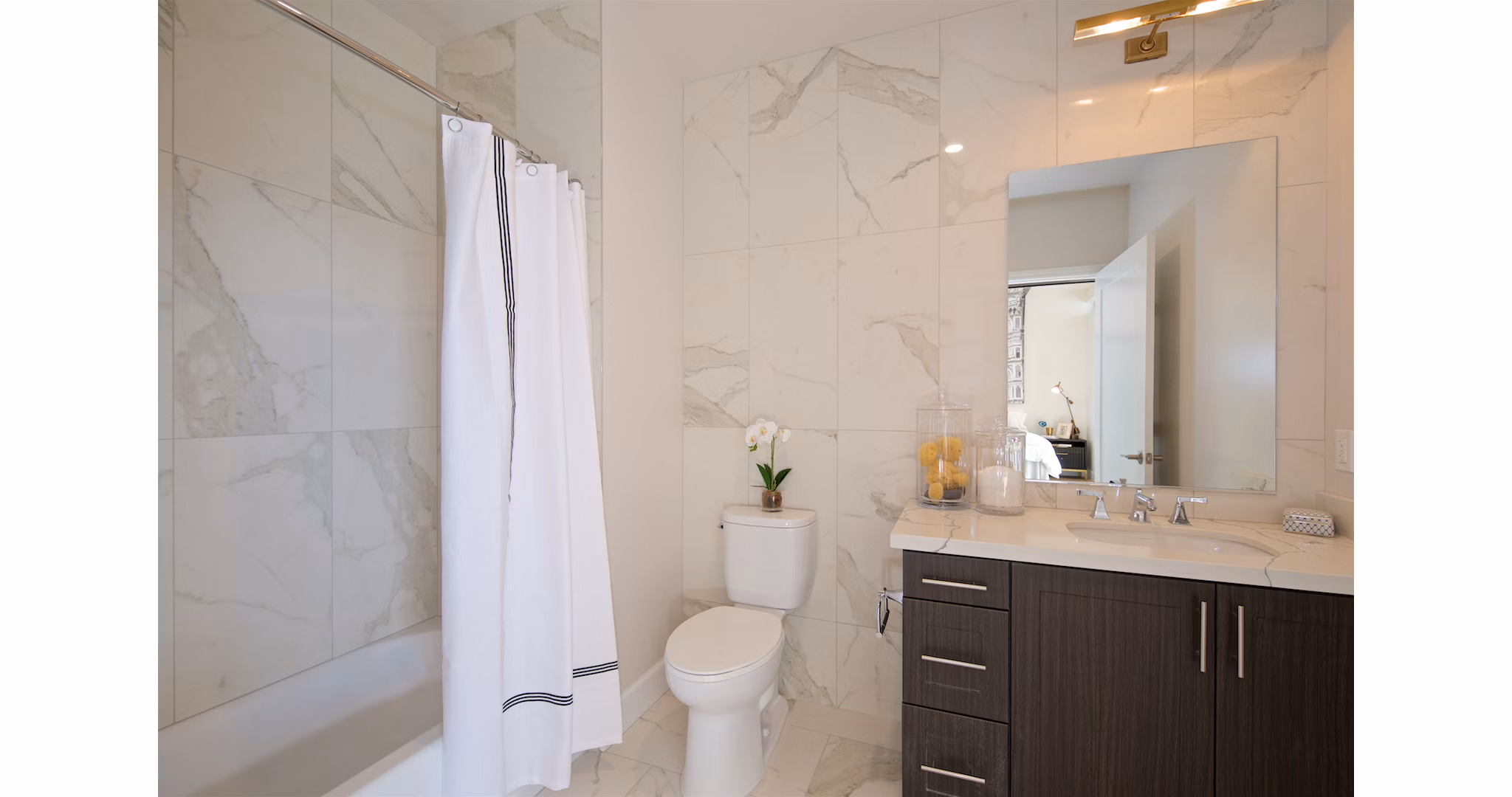 Modern bathroom with sleek fixtures at Eighteen Ten State St Apartments offering luxury living in urban settings