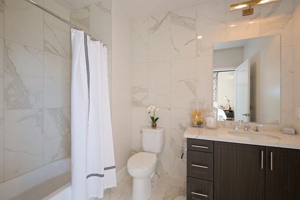 Modern bathroom with sleek fixtures at Eighteen Ten State St Apartments offering luxury living in urban settings