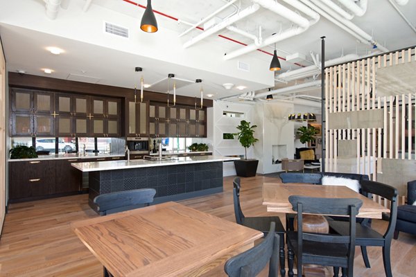 Clubhouse featuring modern design and cozy seating at Eighteen Ten State St Apartments, a Greystar luxury apartment community