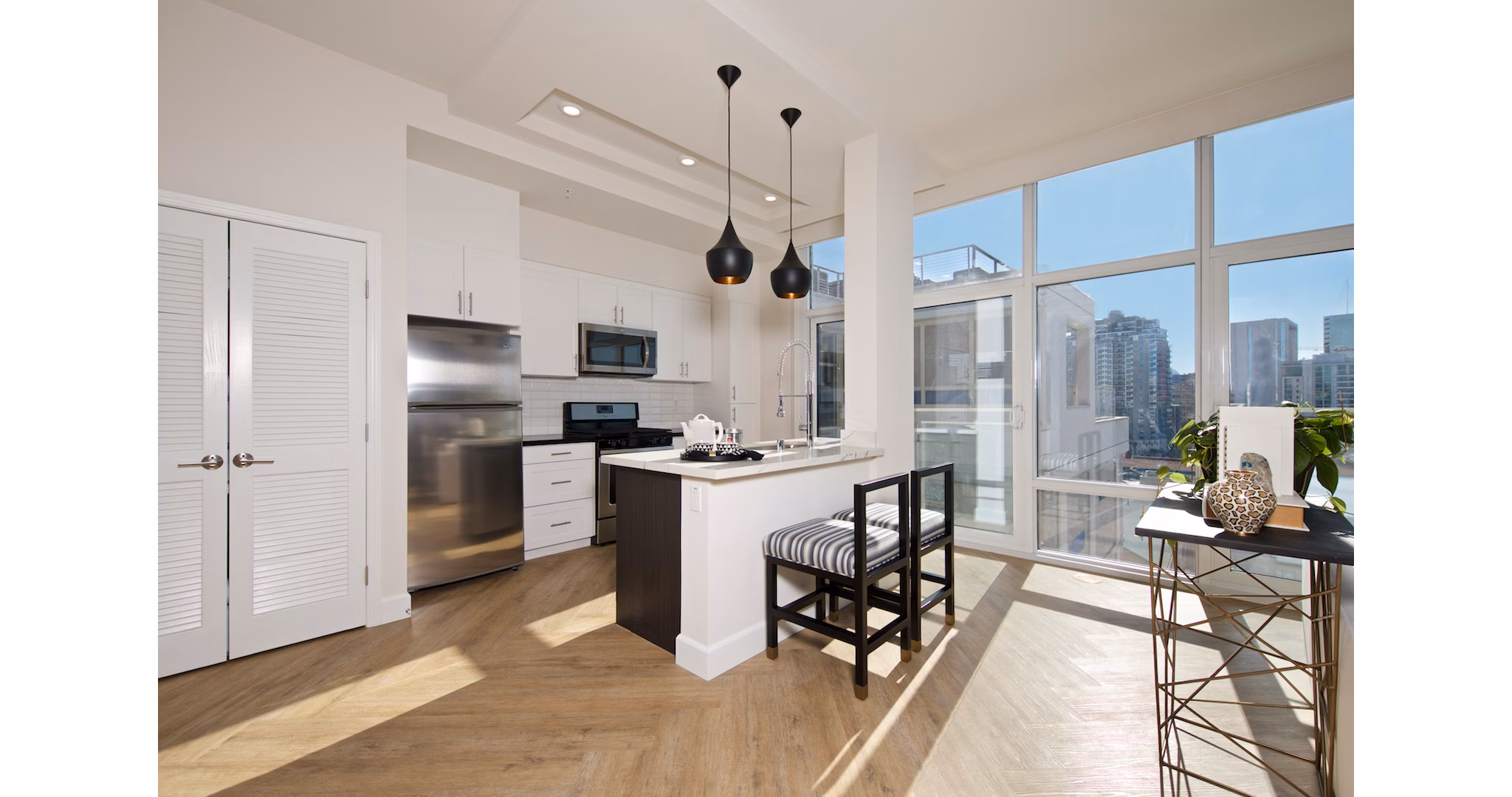 Modern kitchen with stainless steel appliances at Eighteen Ten State St Apartments, offering a luxury living experience