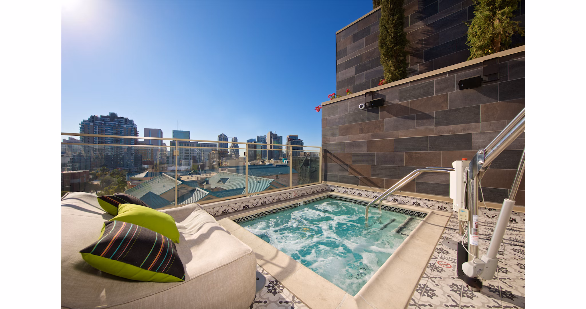 Relaxing hot tub at Eighteen Ten State St Apartments, a prime luxury community offering comfort and leisure amenities