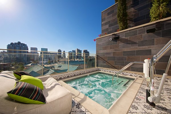 Relaxing hot tub at Eighteen Ten State St Apartments, a prime luxury community offering comfort and leisure amenities