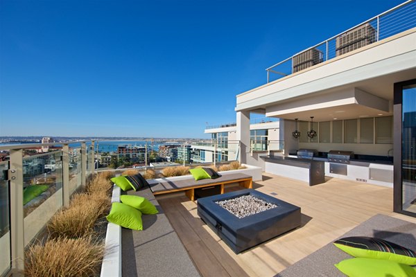 Cozy outdoor fire pit area at Eighteen Ten State St Apartments, ideal for gatherings and relaxation in a luxury apartment setting