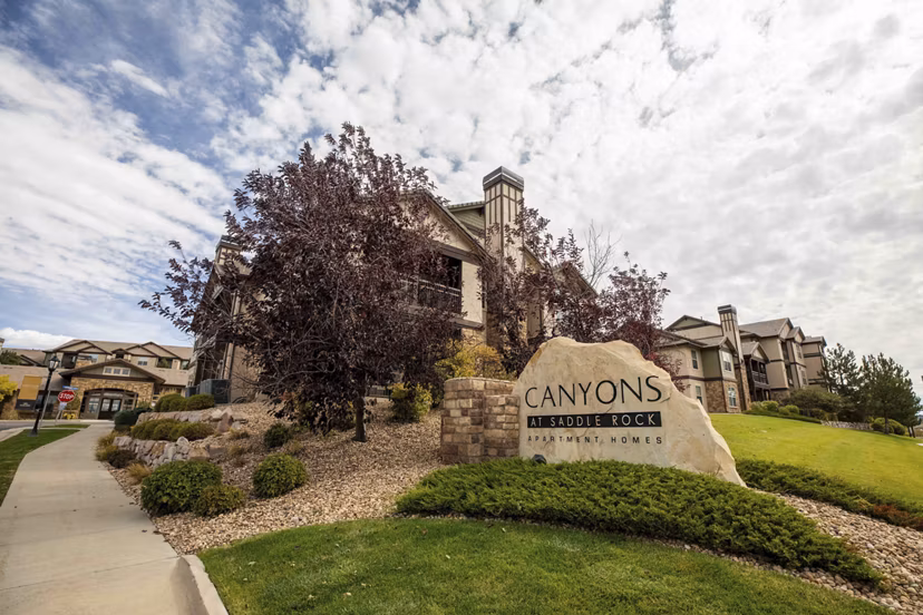 Canyons at Saddle Rock Apartments: Elegant building with prominent signage