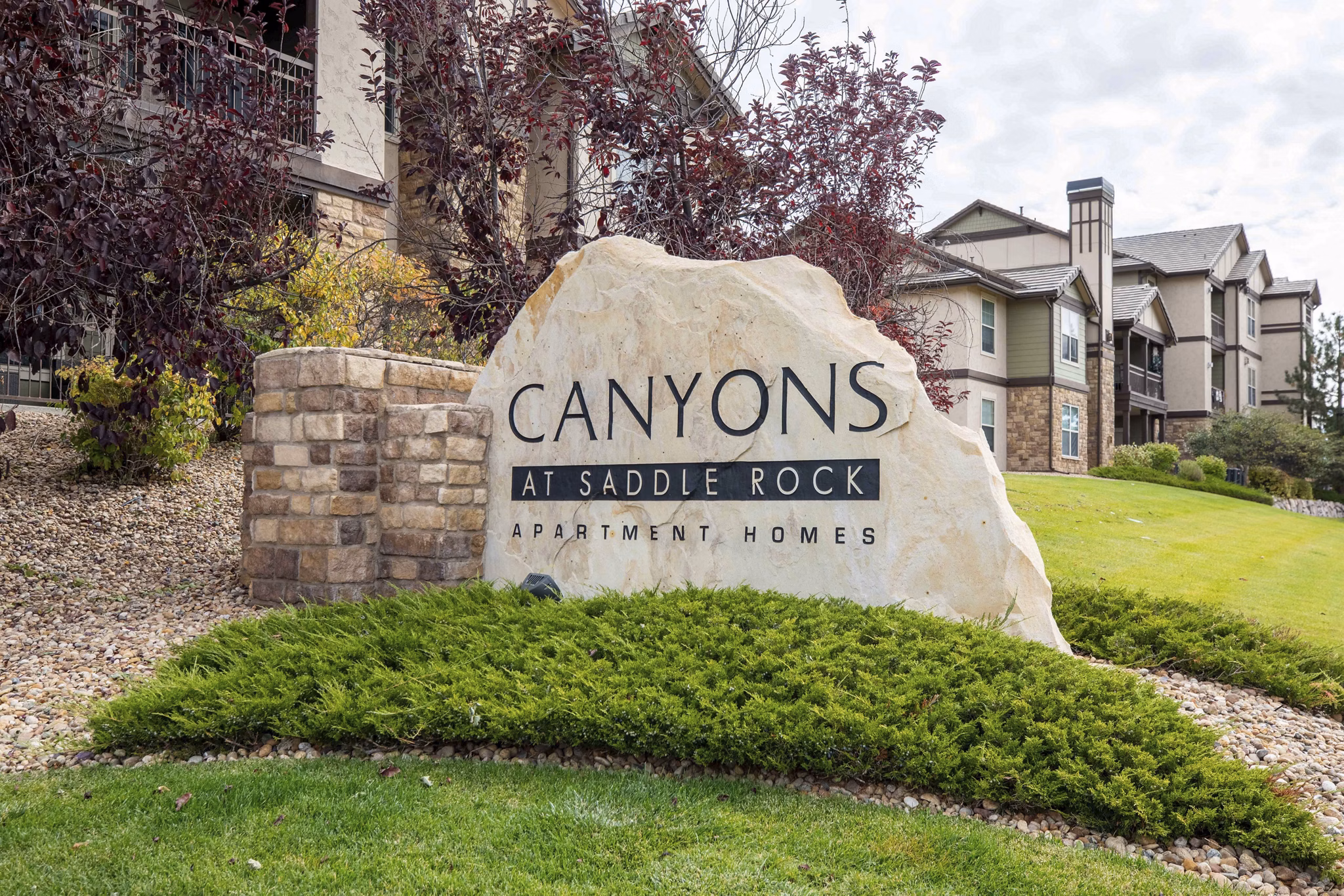 Canyons at Saddle Rock Apartments: Building with signage in Aurora, Colorado