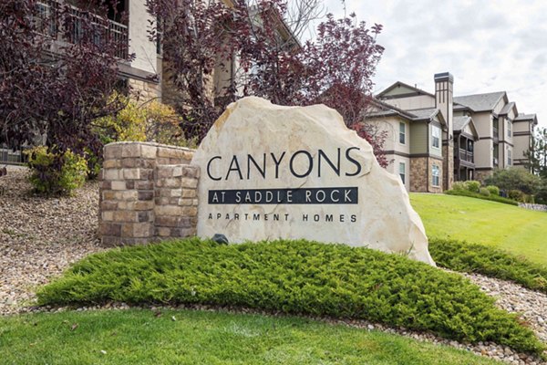Canyons at Saddle Rock Apartments: Building with signage in Aurora, Colorado