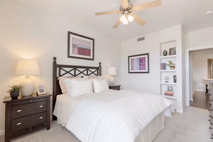 Bedroom featuring modern design and natural light at Canyons at Saddle Rock Apartments