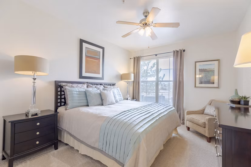 Cozy bedroom featuring elegant decor at Canyons at Saddle Rock Apartments