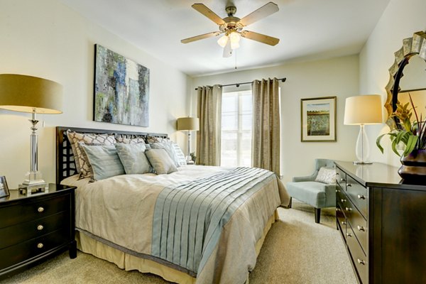 Cozy bedroom featuring elegant decor at Canyons at Saddle Rock Apartments