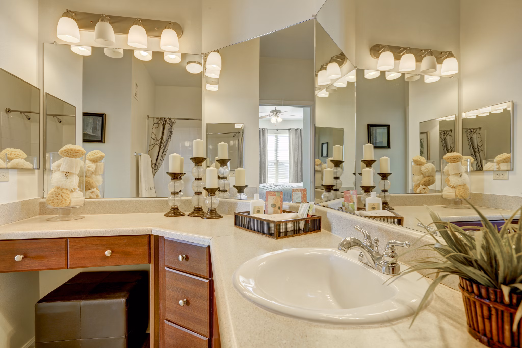 Bathroom featuring modern fixtures and marble countertops in Canyons at Saddle Rock Apartments