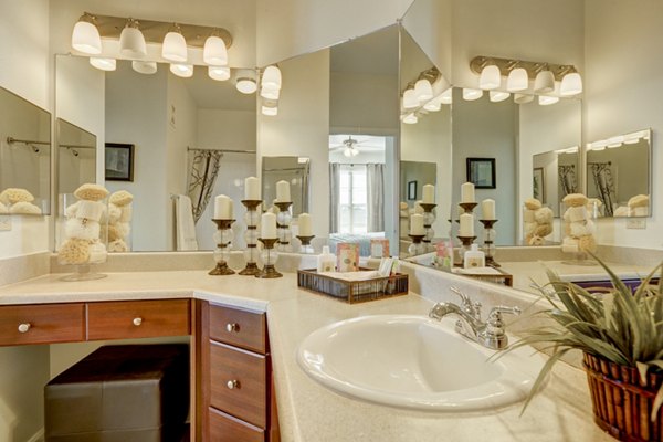 Bathroom featuring modern fixtures and marble countertops in Canyons at Saddle Rock Apartments